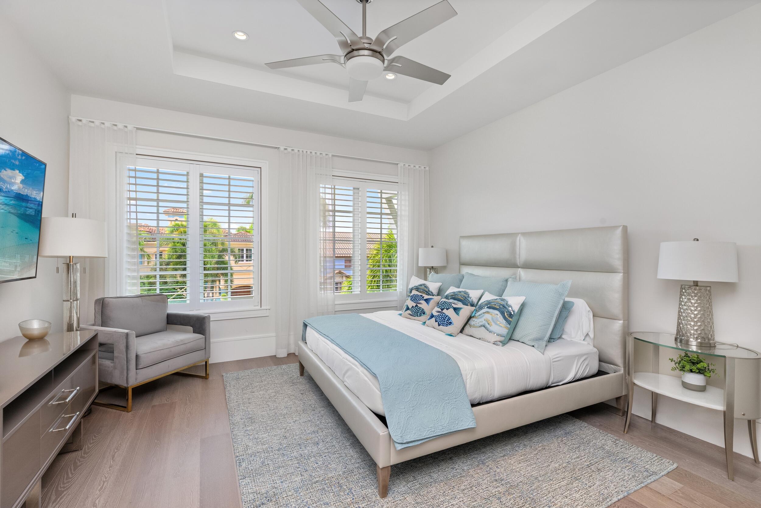 863 Enfield Street Boca Raton, FL 33487 - Photo 53 of 67 a bedroom with a bed couch and windows