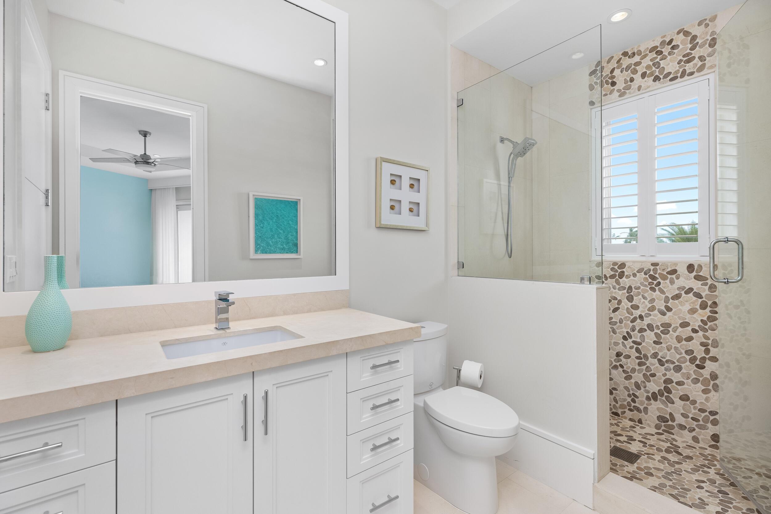 863 Enfield Street Boca Raton, FL 33487 - Photo 56 of 67 a bathroom with a sink toilet vanity and window