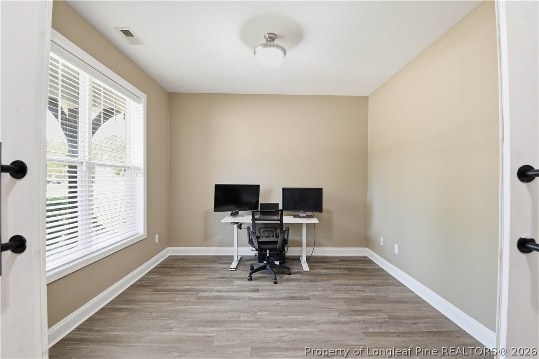 140 Birch Avenue Spring Lake, NC 28390 - Photo 15 of 49 a view of a workspace with furniture and a window