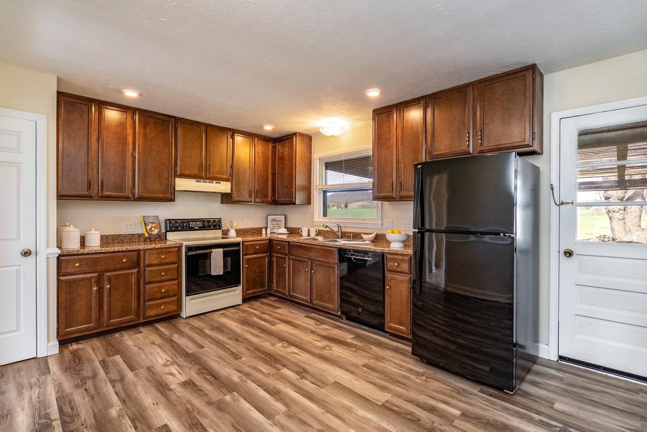 456 Eckert Circle Harrisonburg, VA 22801 - Photo 11 of 48 a kitchen with stainless steel appliances granite countertop a refrigerator stove and oven