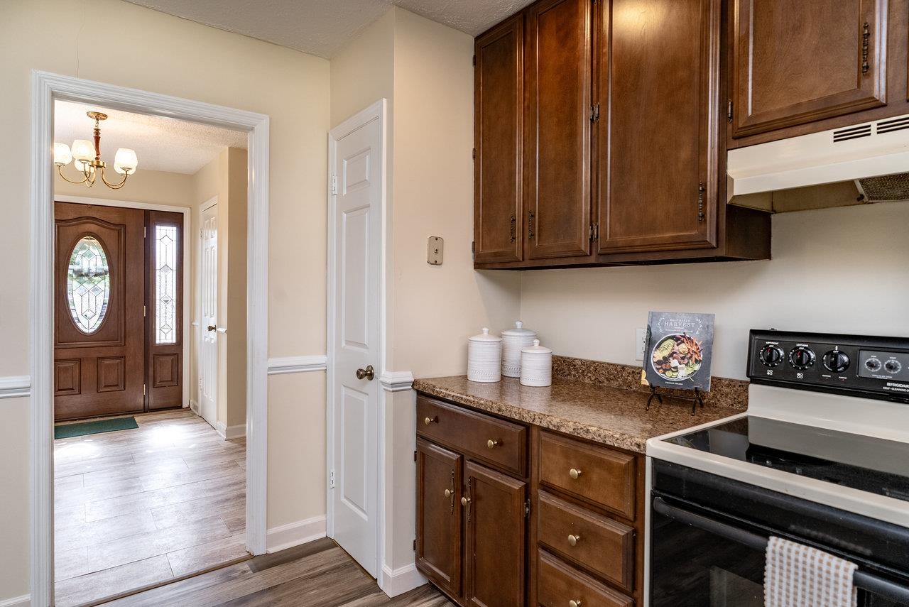 456 Eckert Circle Harrisonburg, VA 22801 - Photo 15 of 48 a kitchen with granite countertop a sink cabinets and stainless steel appliances