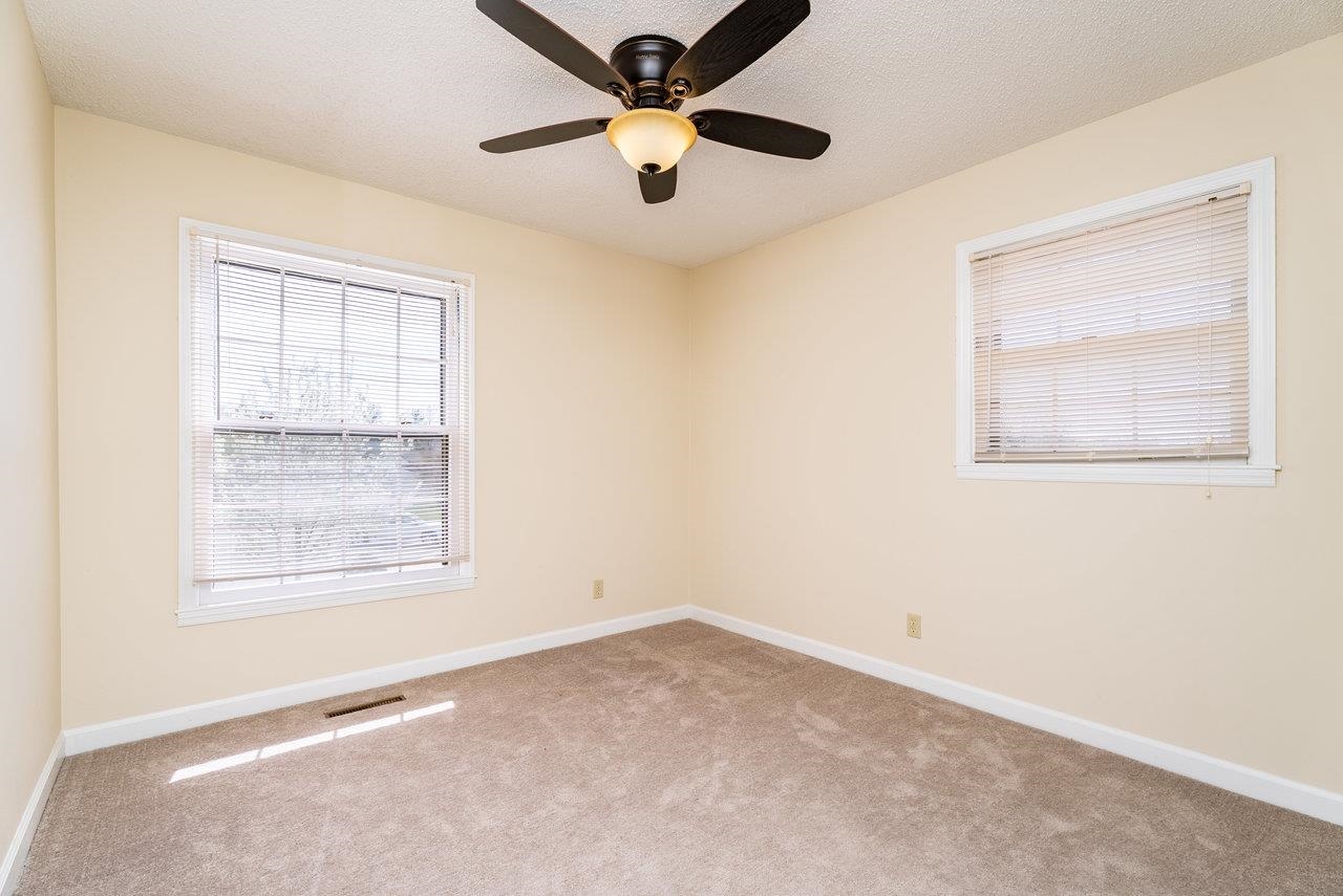 456 Eckert Circle Harrisonburg, VA 22801 - Photo 19 of 48 an empty room with a window and a fan