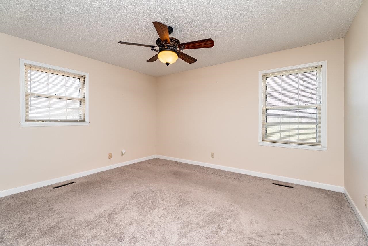 456 Eckert Circle Harrisonburg, VA 22801 - Photo 21 of 48 an empty room with windows and fan