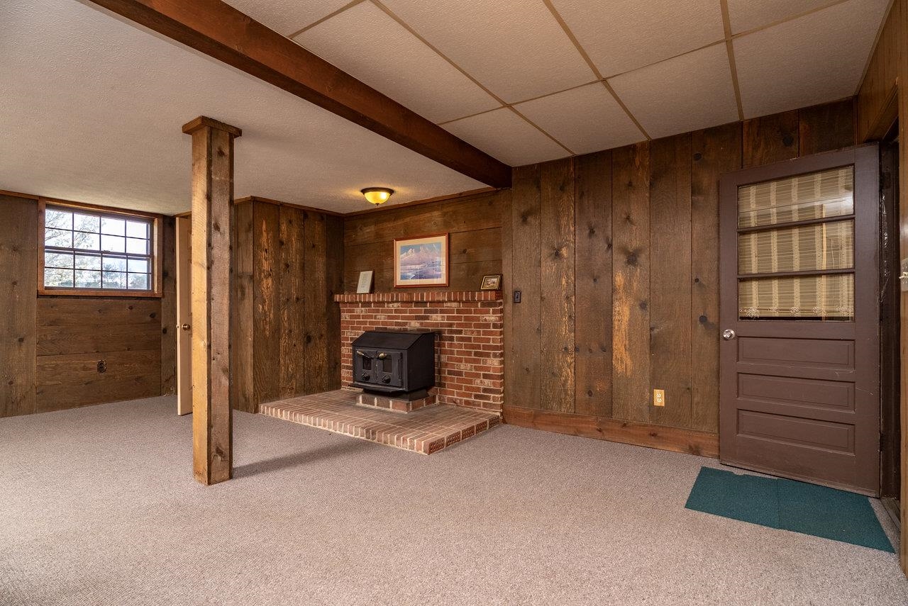 456 Eckert Circle Harrisonburg, VA 22801 - Photo 30 of 48 a view of an empty room with a fireplace and a window