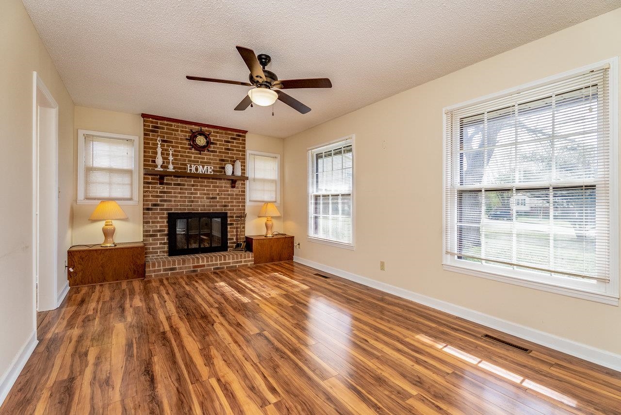 456 Eckert Circle Harrisonburg, VA 22801 - Photo 7 of 48 a living room with a fireplace furniture and a window