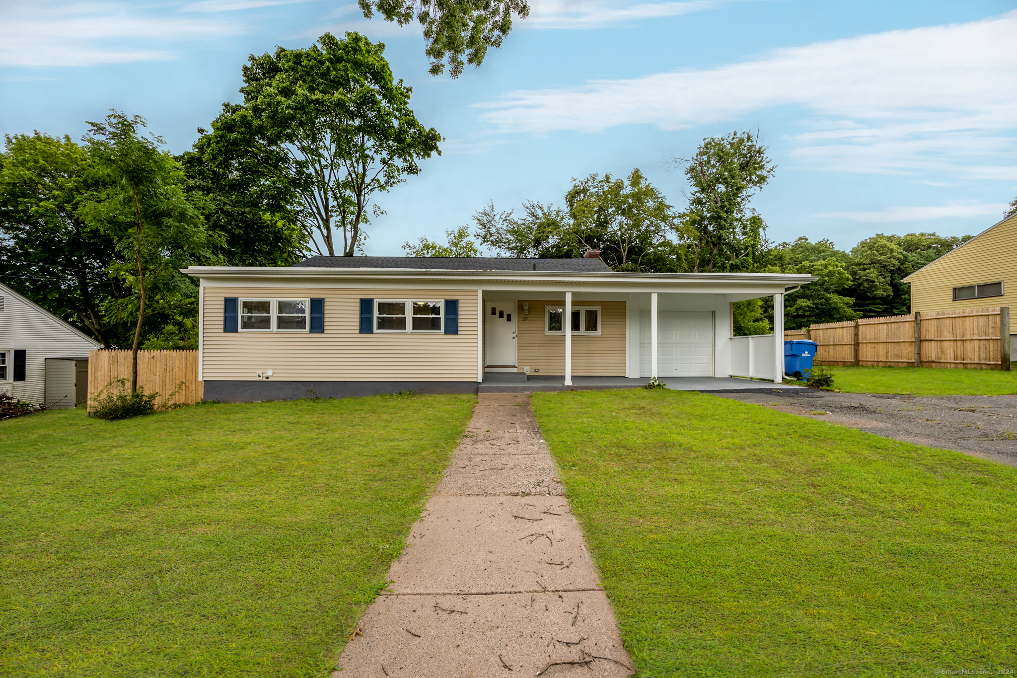 front view of a house with a garden