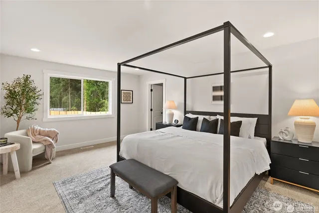 a bedroom with a bed and window