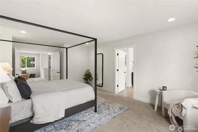 a bedroom with a bed and a couch