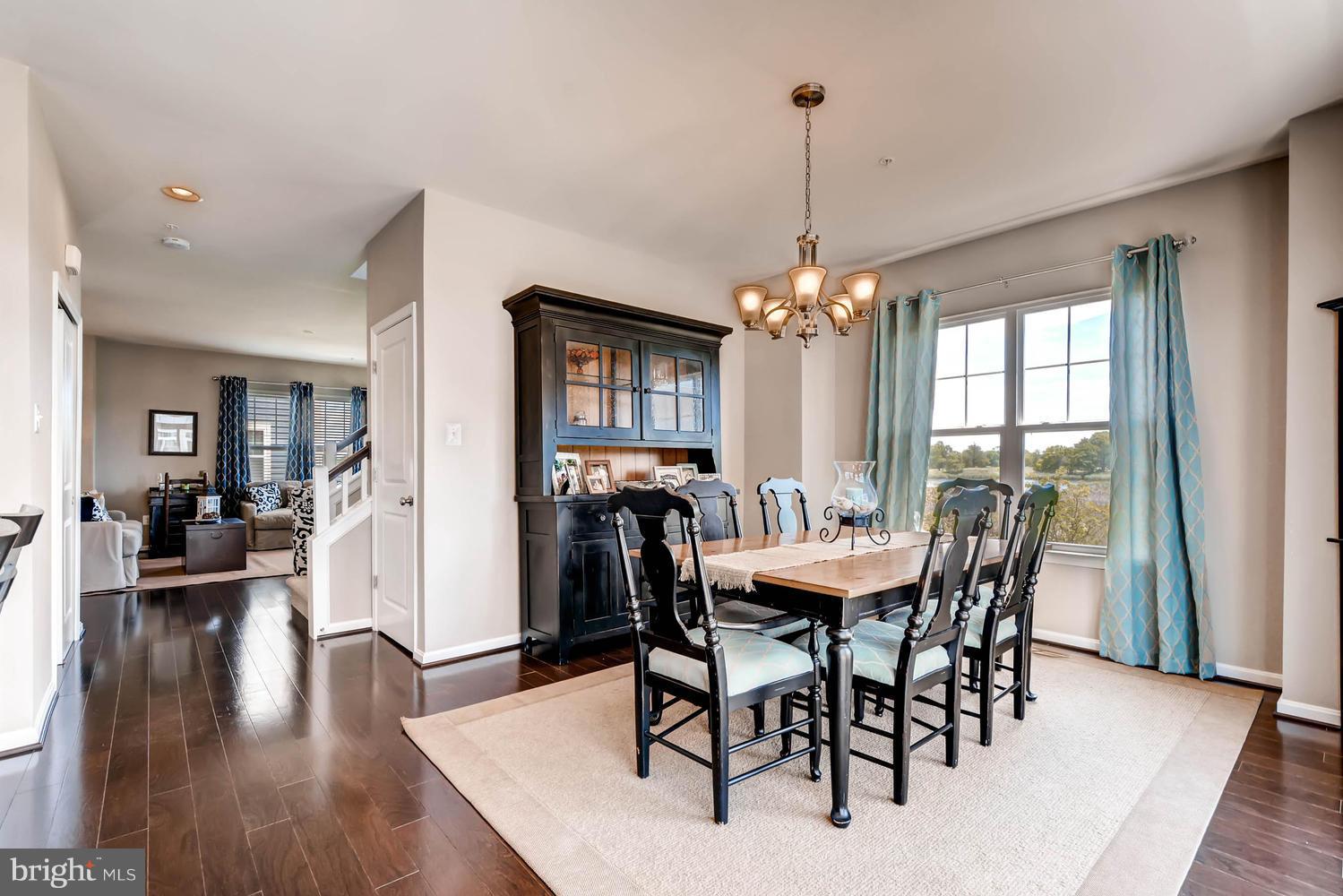 2033 Case Road Baltimore, MD 21222 - Photo 7 of 30 a view of a dining room with furniture window and wooden floor