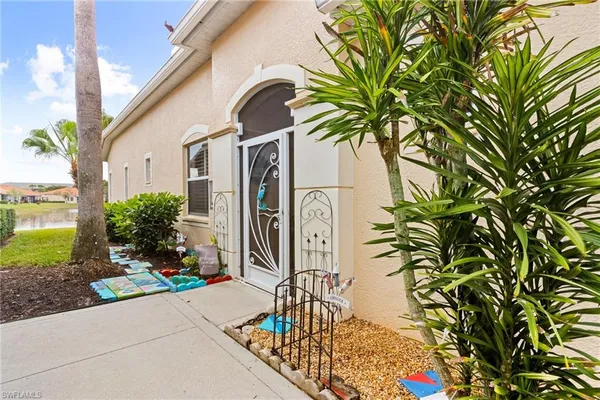a couple of potted plants in front of door