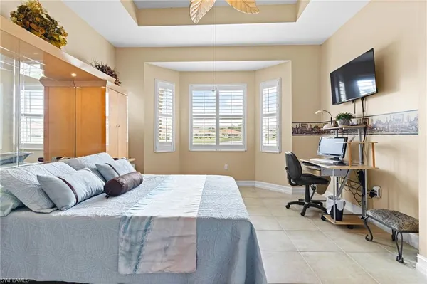 a view of a livingroom with workspace and a window