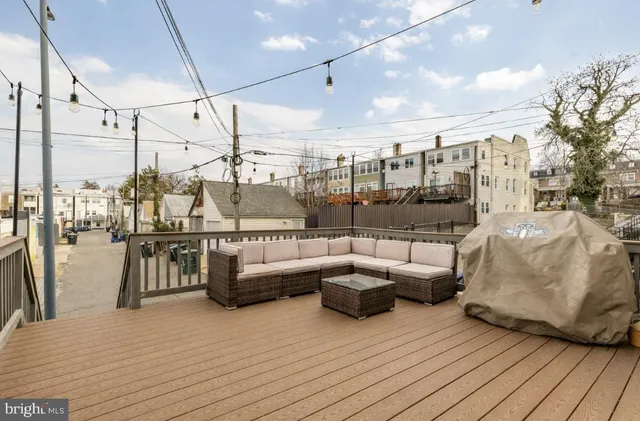 a view of a brick house with many windows