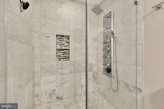 a bathroom with a sink toilet and a mirror