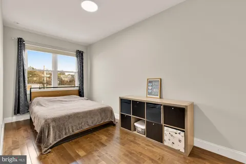 a bathroom with a sink a toilet and shower curtain