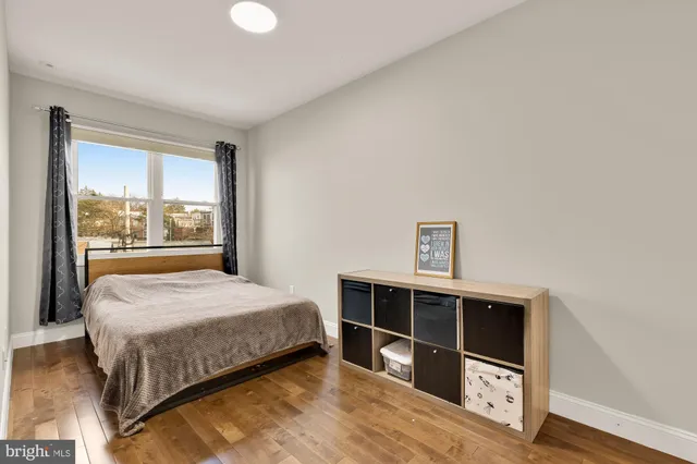 a bathroom with a sink a toilet and shower curtain