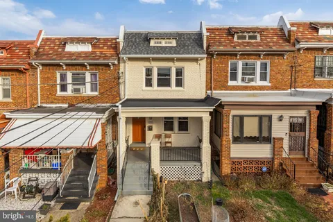 a front view of a house with a large window