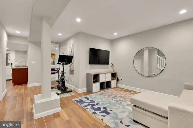 a living room with furniture and a rug