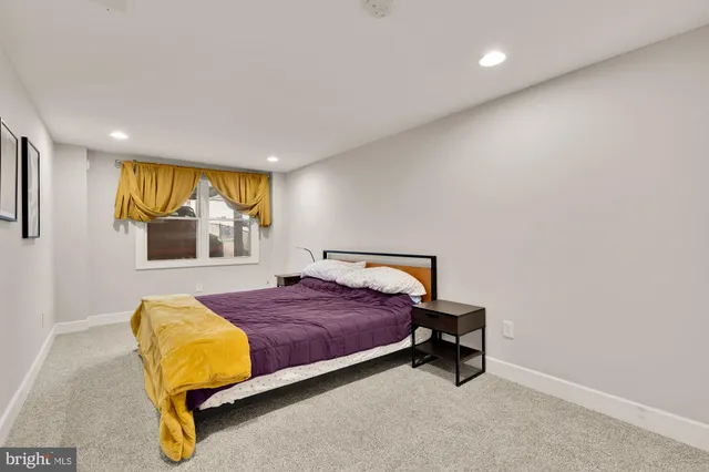 a bathroom with a sink toilet vanity and shower