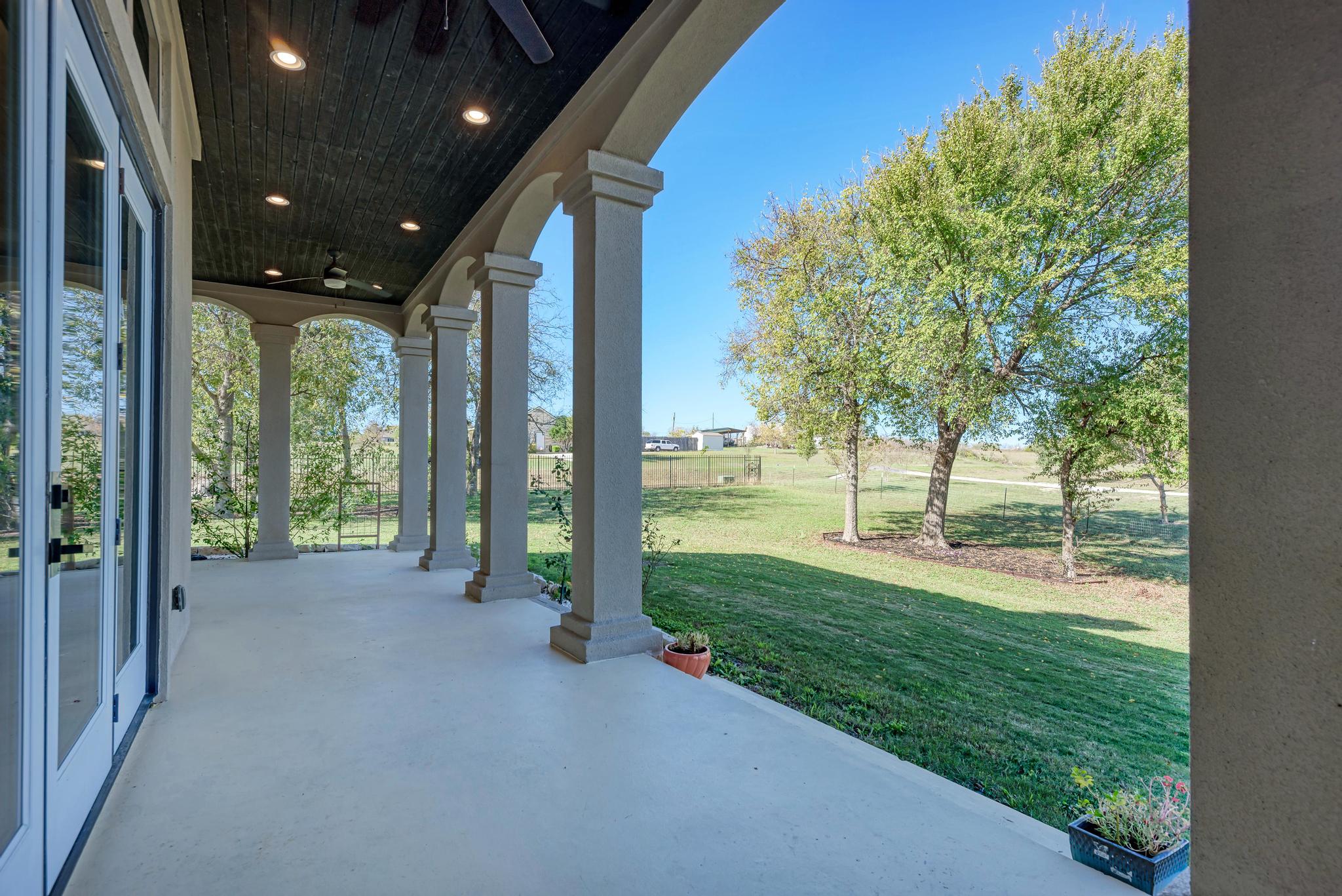 104 Spring Valley Street Hutto, TX 78634 - Photo 31 of 40 View of patio featuring a ceiling fan