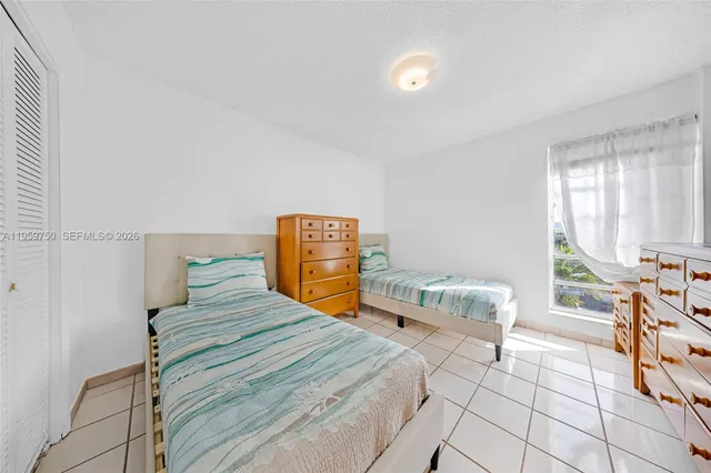 a bedroom with a bed and a cabinets