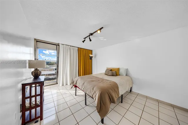 a bedroom with a bed and a book shelf