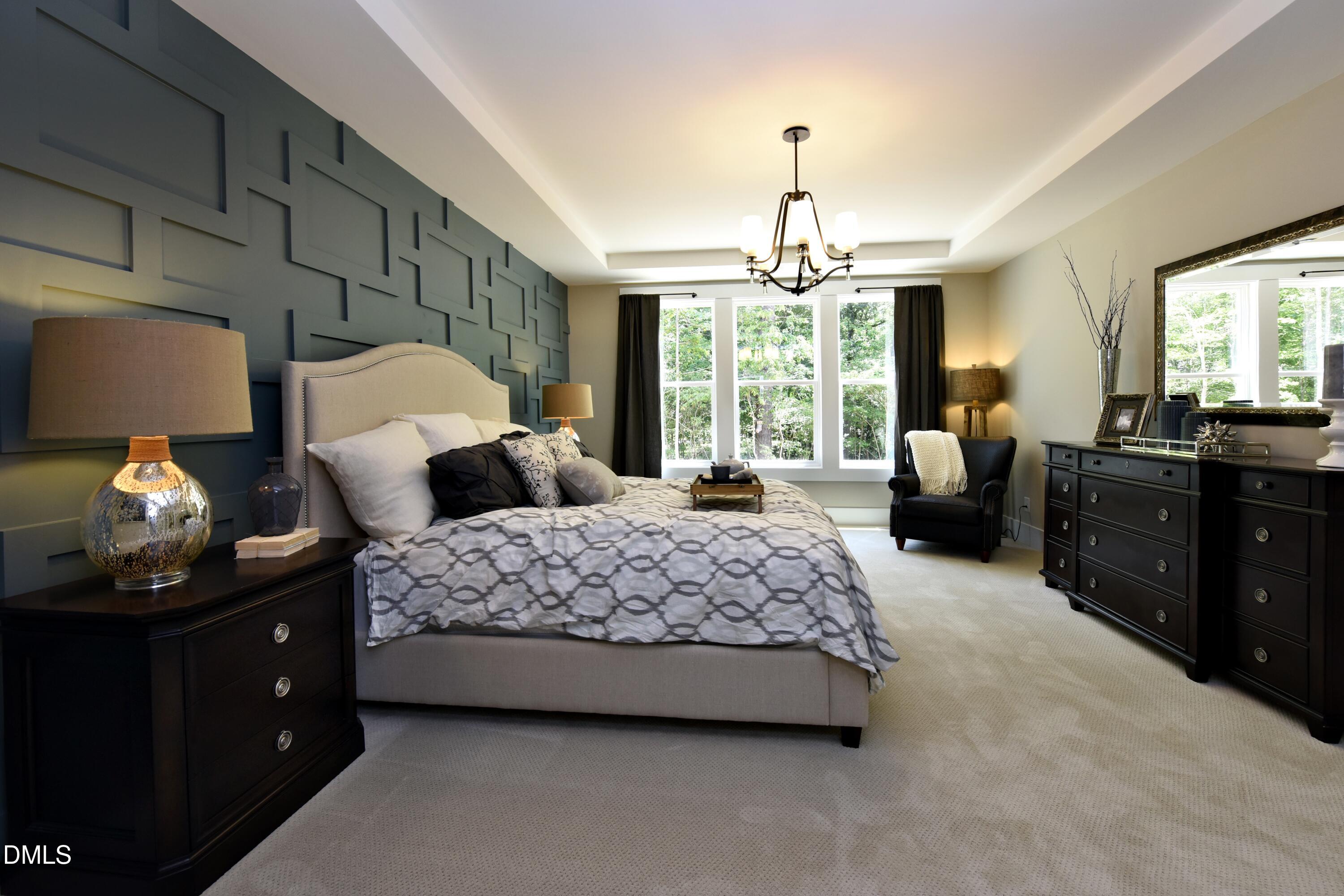 4 Wolf Tree Way Efland, NC 27243 - Photo 12 of 28 a bedroom with a bed and window