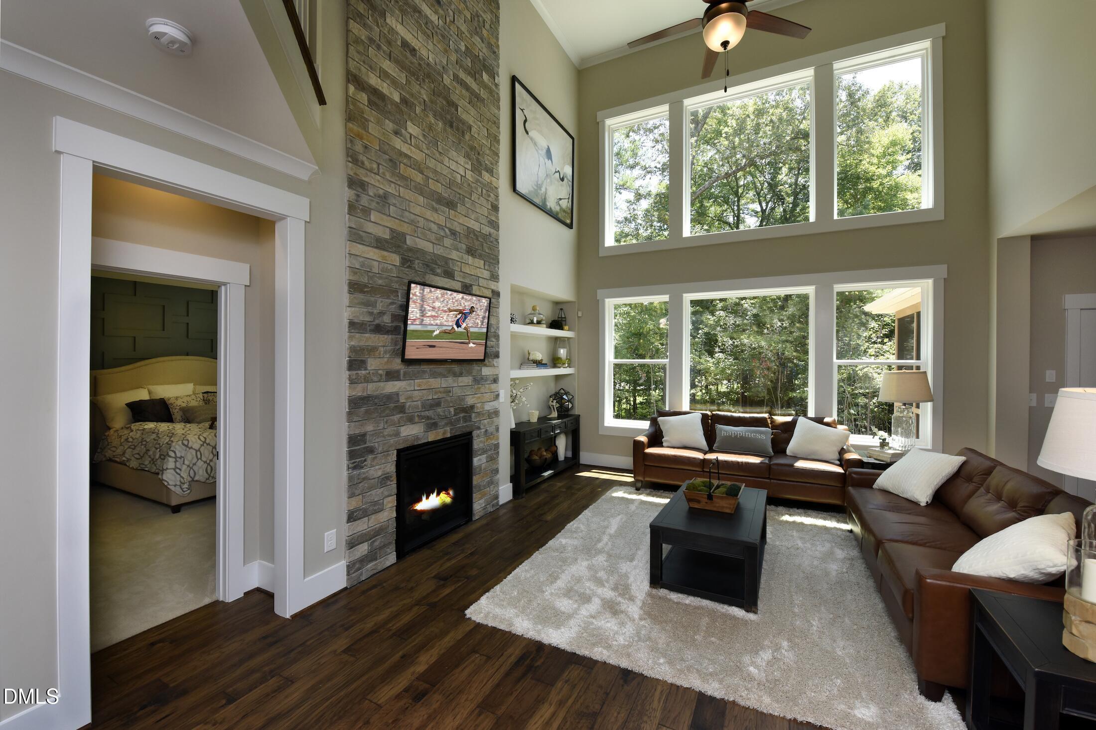 4 Wolf Tree Way Efland, NC 27243 - Photo 2 of 28 a living room with fireplace furniture and a large window