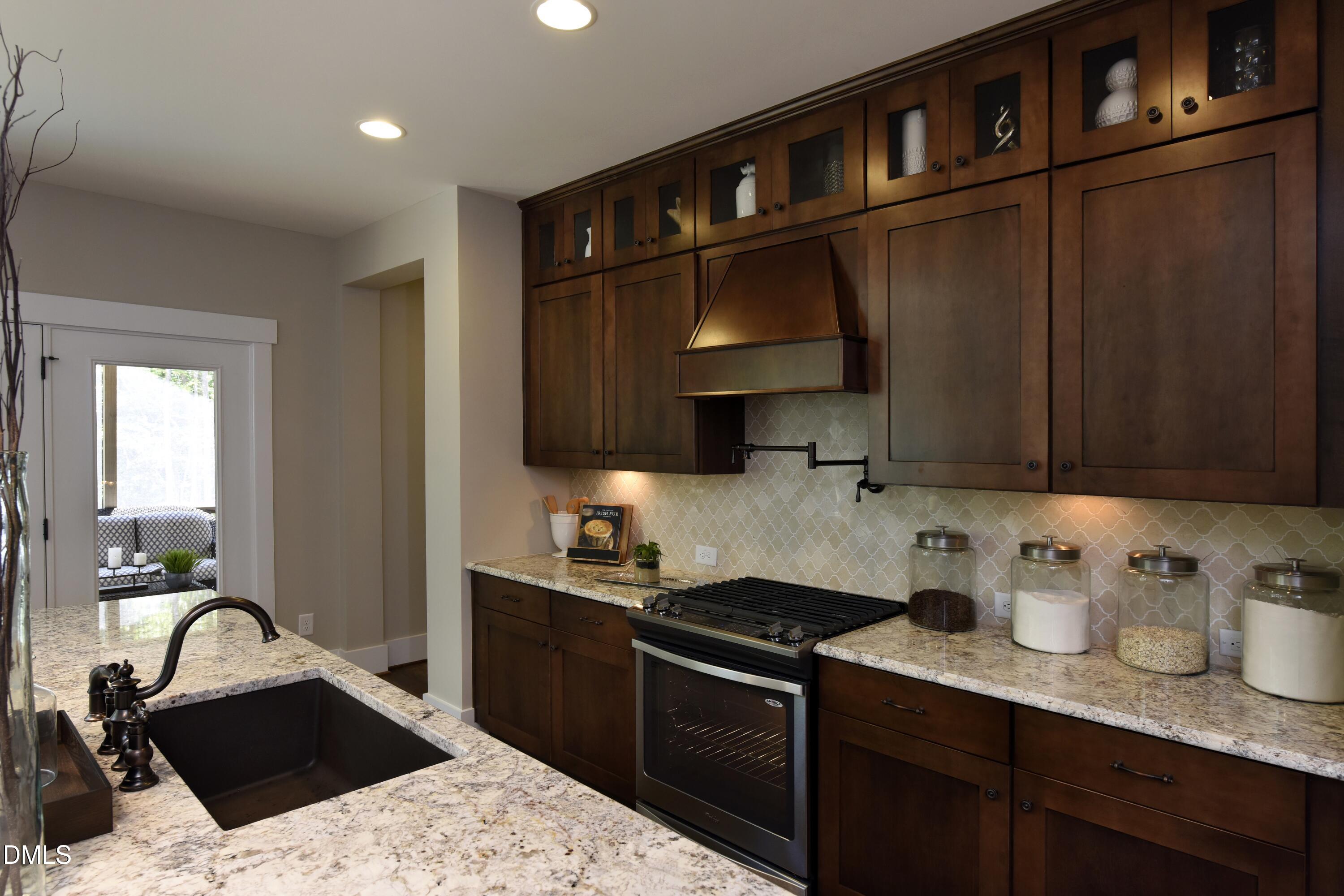 4 Wolf Tree Way Efland, NC 27243 - Photo 6 of 28 a kitchen with a sink and cabinets