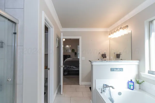 a view of a hallway and a livingroom with furniture