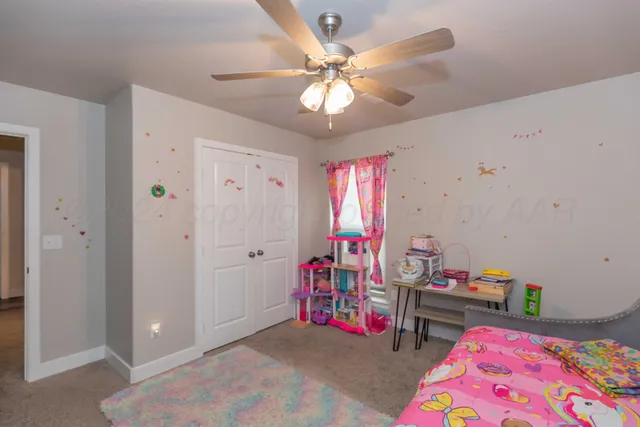 a bedroom with furniture and a chandelier