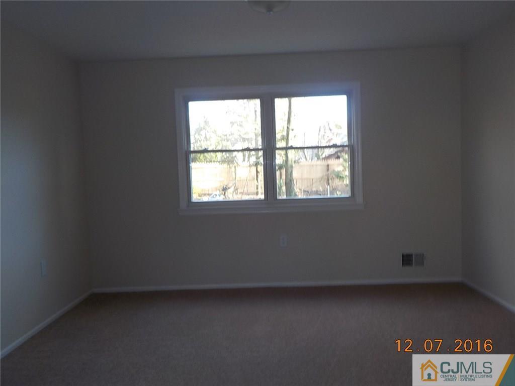 8 Higgins Road Old Bridge, NJ 08857 - Photo 14 of 15 an empty room with a window