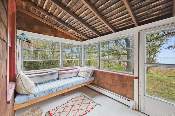 a view of room with large windows