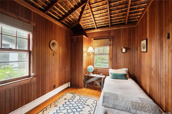 a bed room with a bed and a window