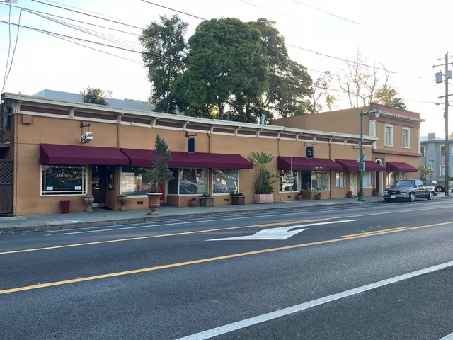 a view of a food mall next to a road