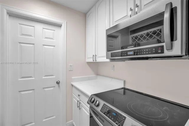 a kitchen with a stove and a microwave