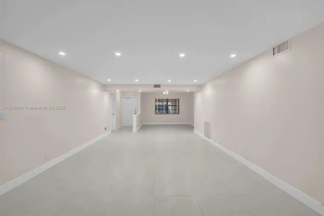 a view of a big room with a kitchen