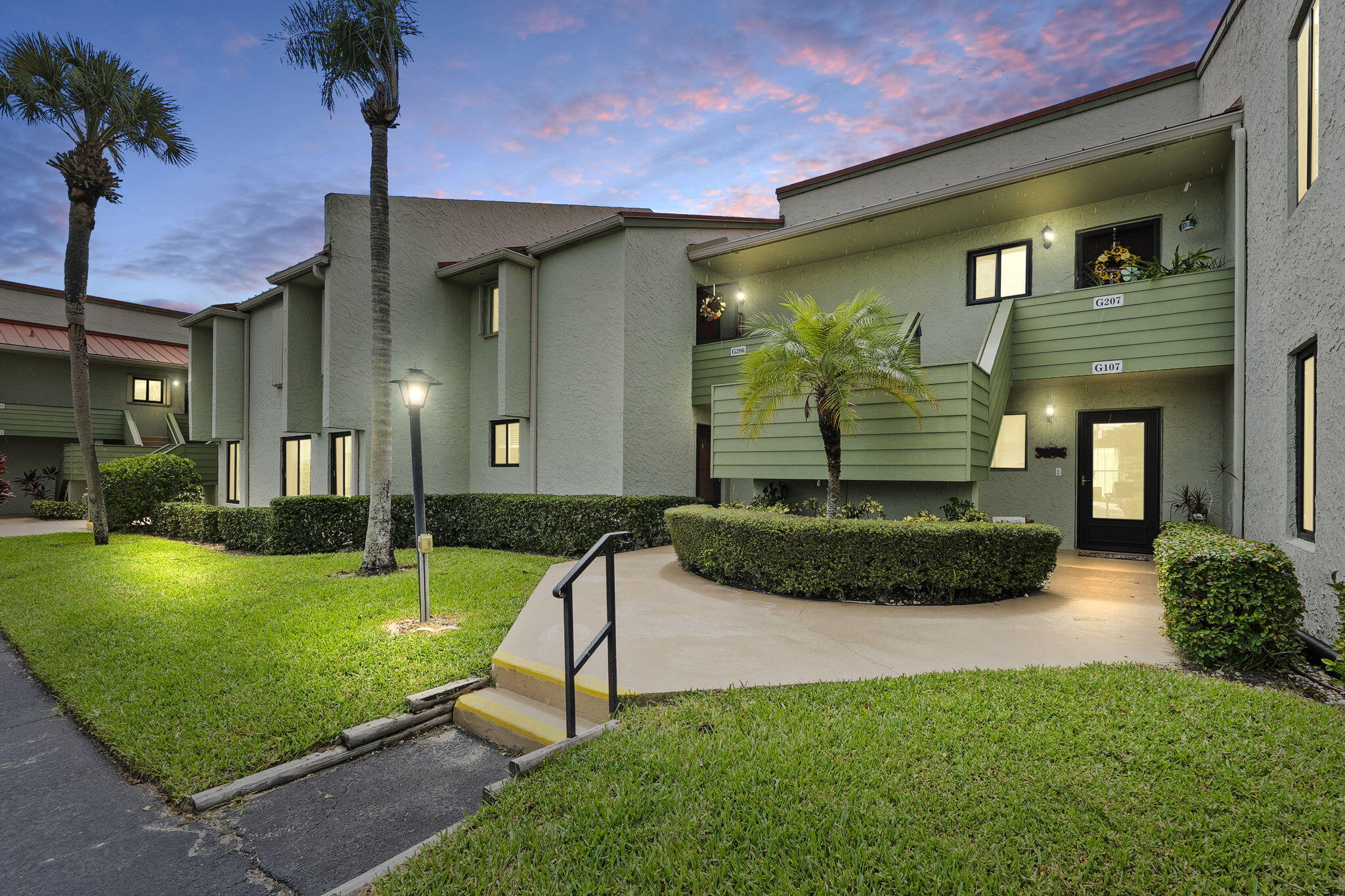 a front view of a house with garden