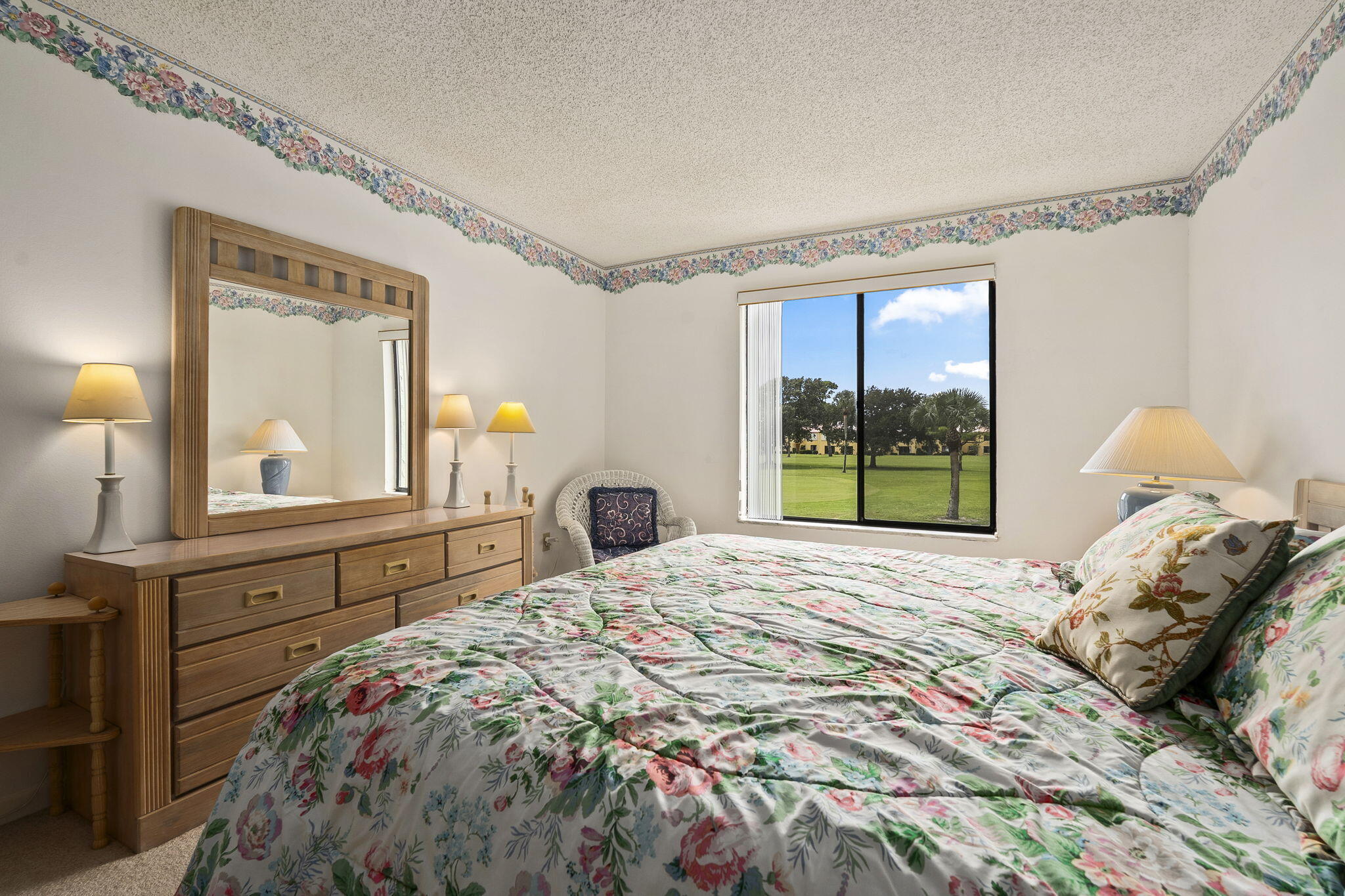 5413 Southeast Miles Grant Road, Unit G206 Stuart, FL 34997 - Photo 12 of 31 a bedroom with a bed and a window
