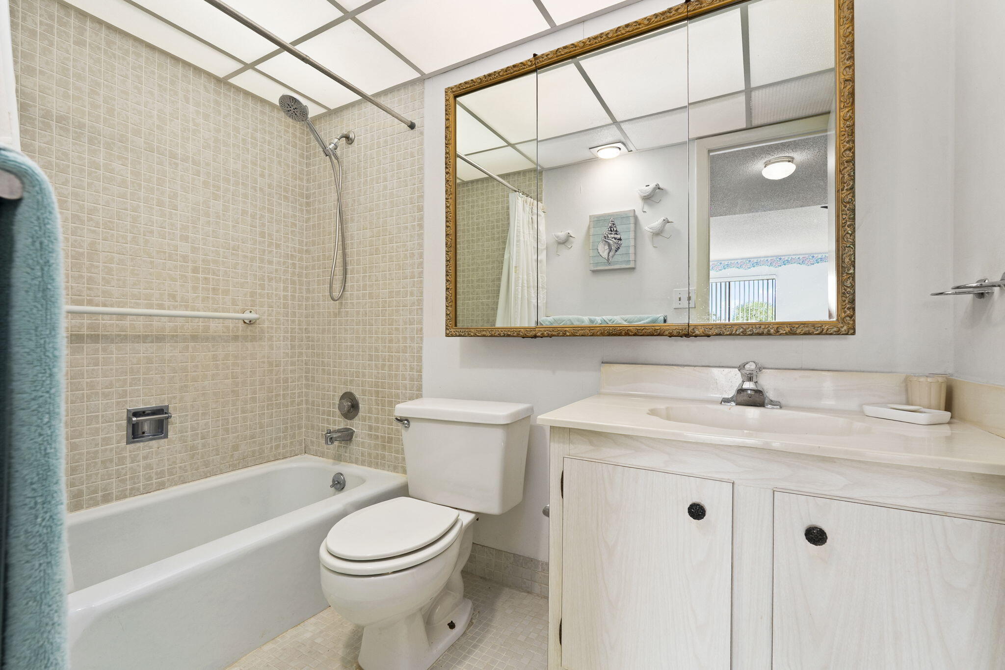 5413 Southeast Miles Grant Road, Unit G206 Stuart, FL 34997 - Photo 14 of 31 a bathroom with a sink a toilet and shower