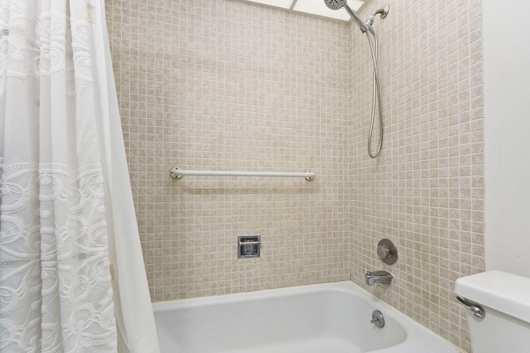 5413 Southeast Miles Grant Road, Unit G206 Stuart, FL 34997 - Photo 15 of 31 a bathroom with a shower and a toilet