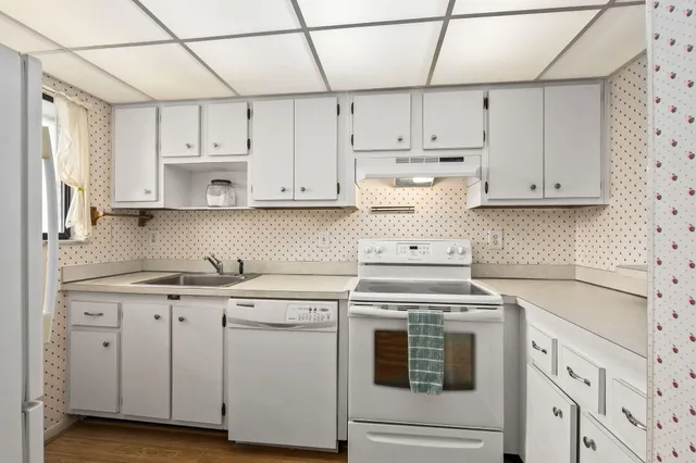 a kitchen with a sink and cabinets