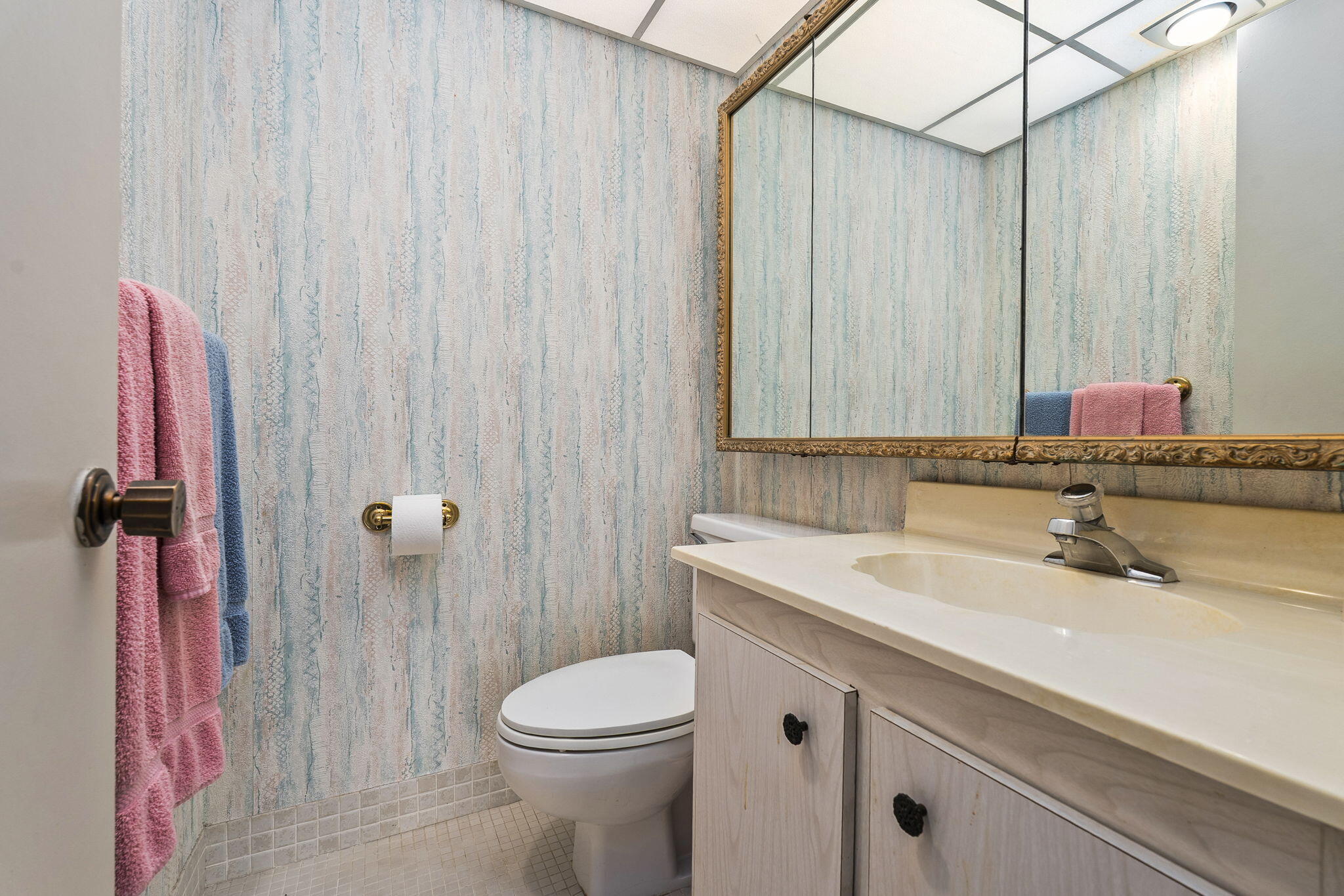 5413 Southeast Miles Grant Road, Unit G206 Stuart, FL 34997 - Photo 19 of 31 a bathroom with a sink a toilet and shower