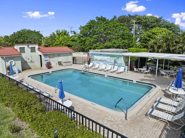 aerial view of a house with a yard