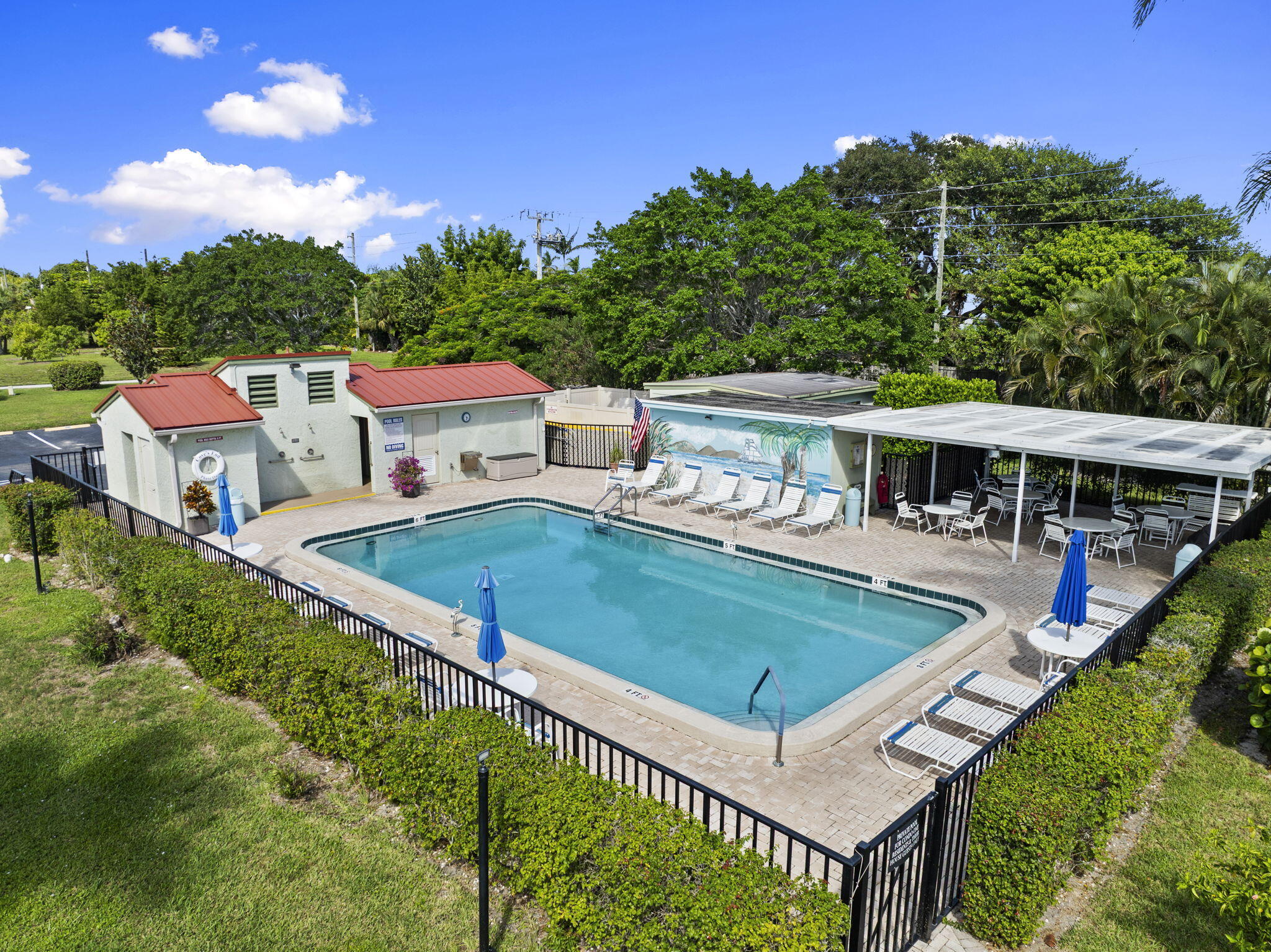 5413 Southeast Miles Grant Road, Unit G206 Stuart, FL 34997 - Photo 22 of 31 aerial view of a house with a yard