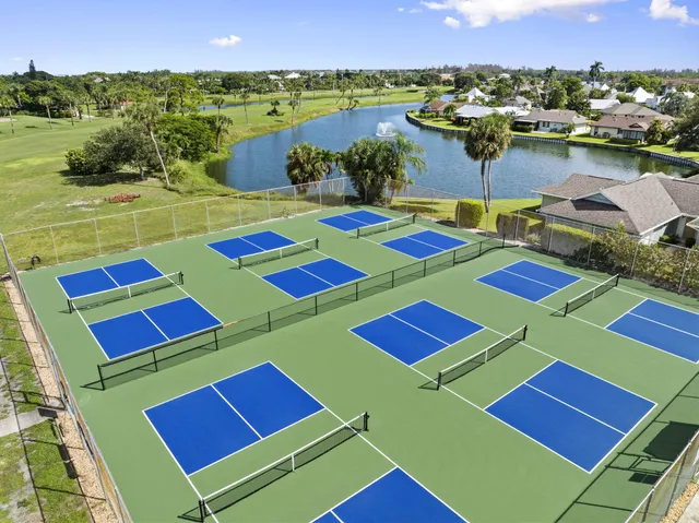 a view of a balcony with a table and chairs