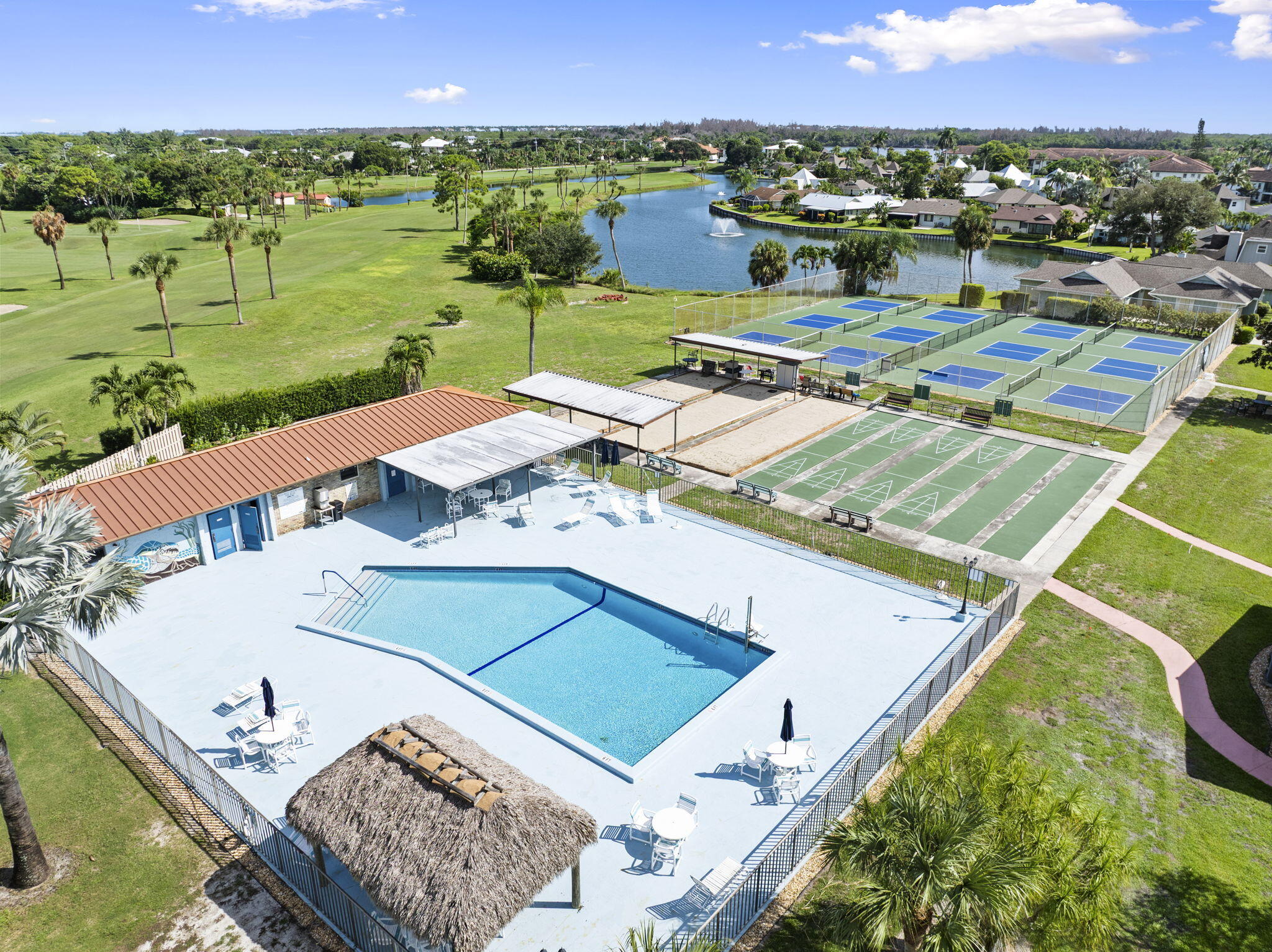 5413 Southeast Miles Grant Road, Unit G206 Stuart, FL 34997 - Photo 26 of 31 a view of a balcony with a table and chairs