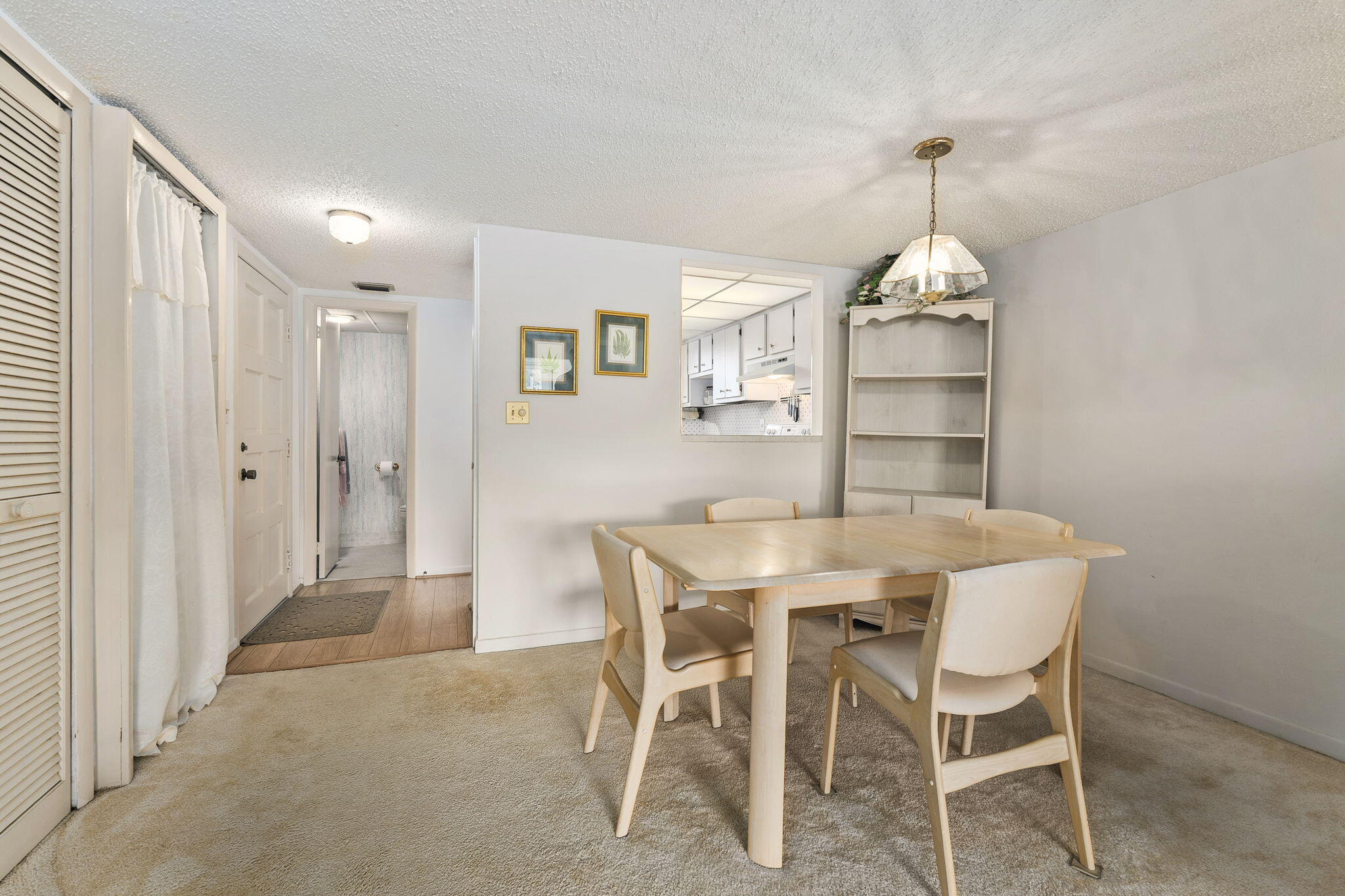 5413 Southeast Miles Grant Road, Unit G206 Stuart, FL 34997 - Photo 5 of 31 a view of a dining room with furniture