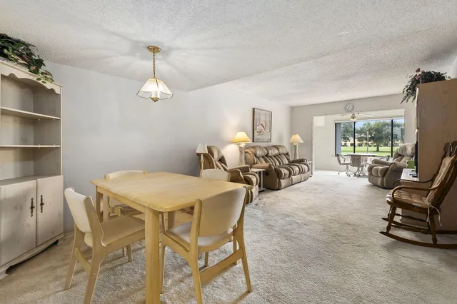 a bedroom with furniture and a flat screen tv