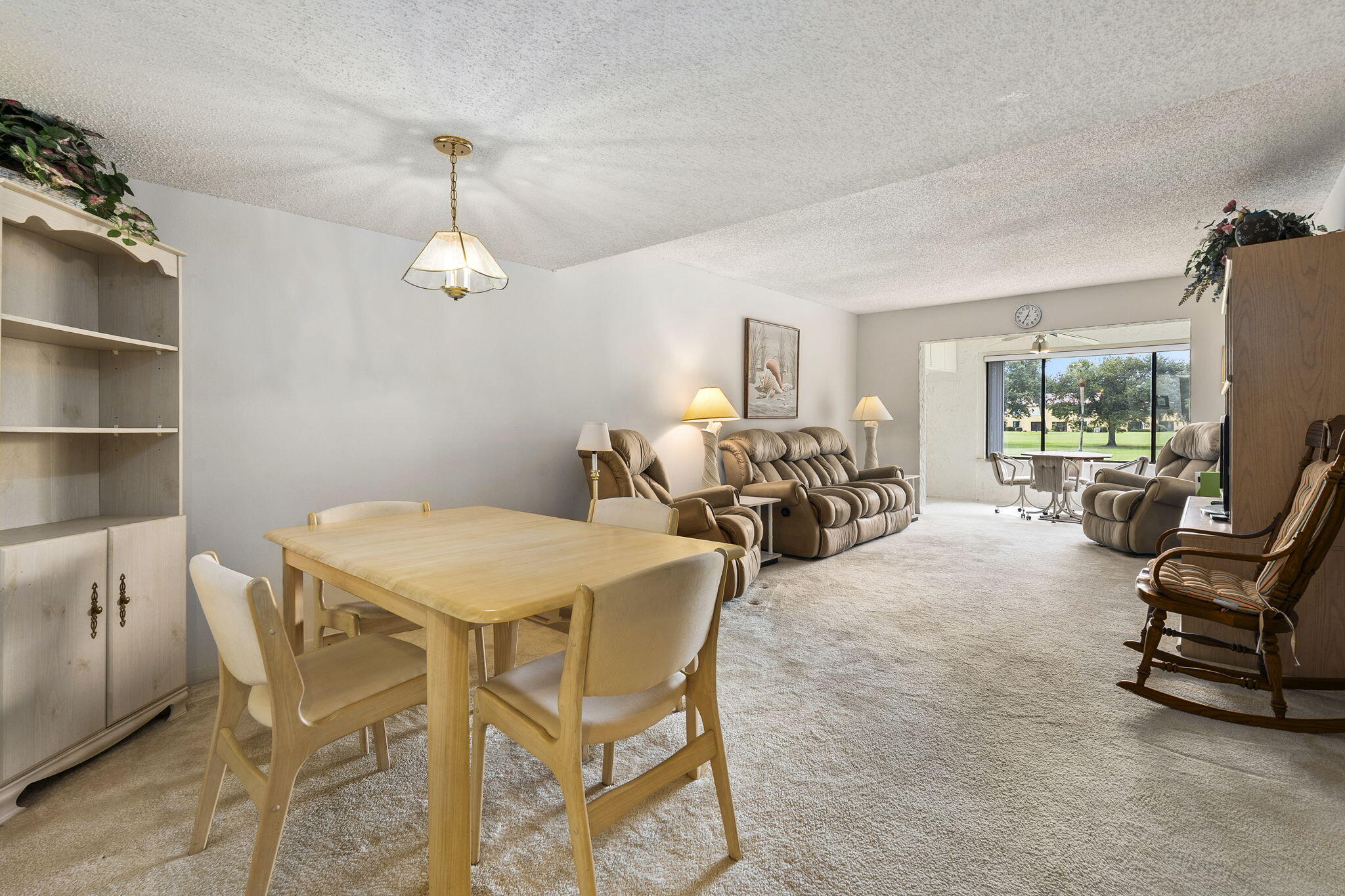 5413 Southeast Miles Grant Road, Unit G206 Stuart, FL 34997 - Photo 6 of 31 a view of a livingroom with furniture and a window