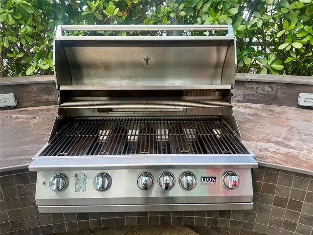 a view of a patio with swimming pool and sitting area